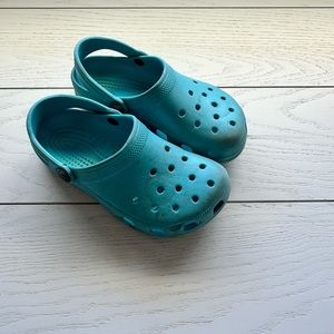 Turquoise kid crocs